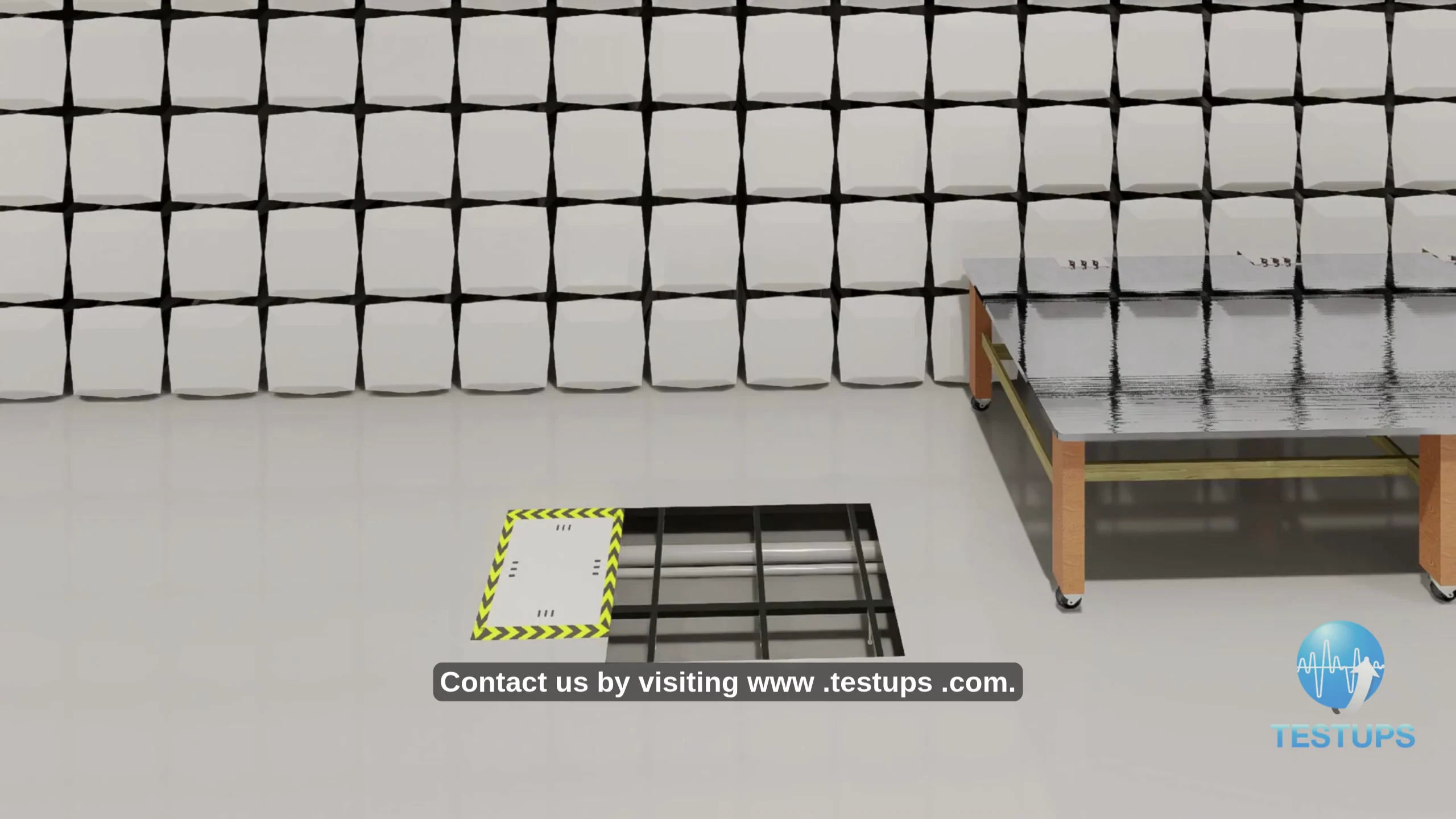 Close-up of TESTUPS chamber construction detail: pyramidal RF absorber array on the chamber wall, ferrite-tile floor with high-current cable trench access panel, and roller-bench dynamometer fairing edge.